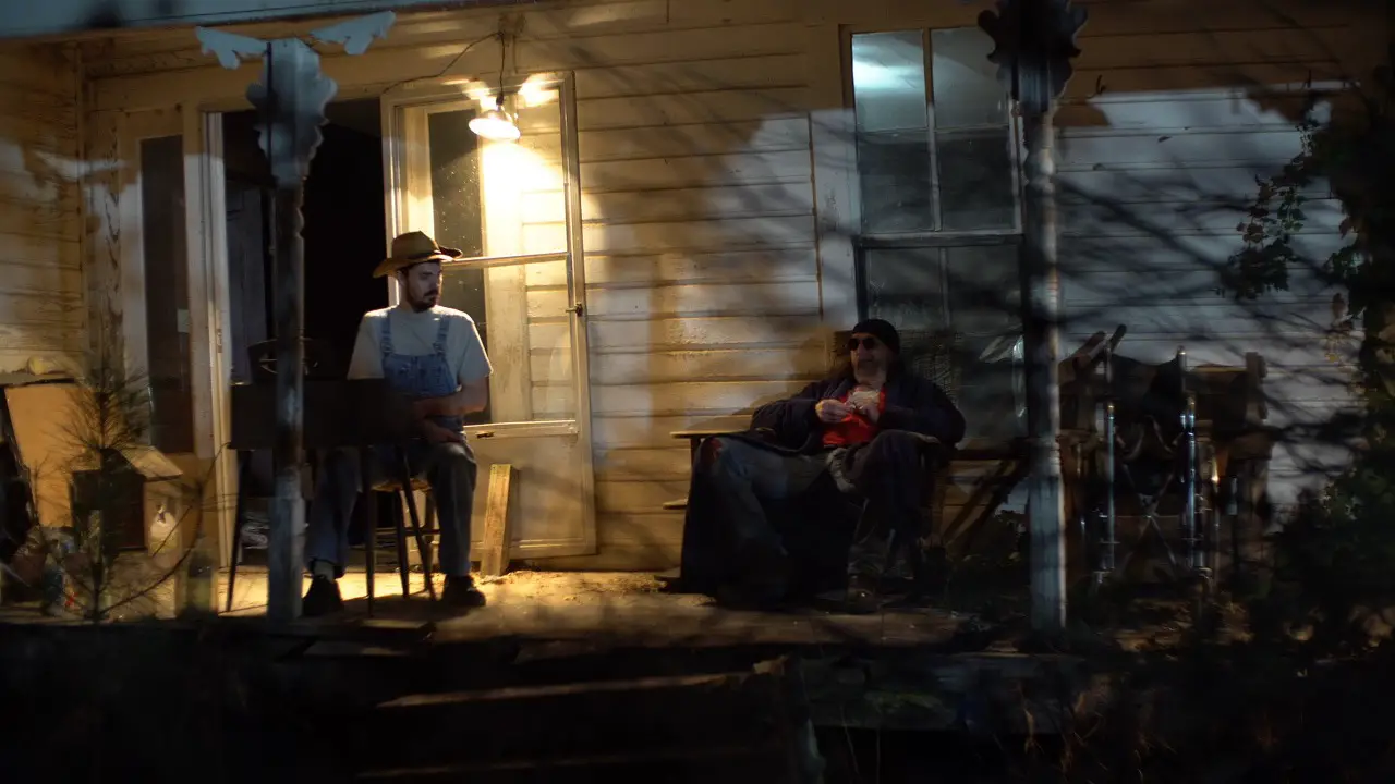 Man on rural porch in The Boo