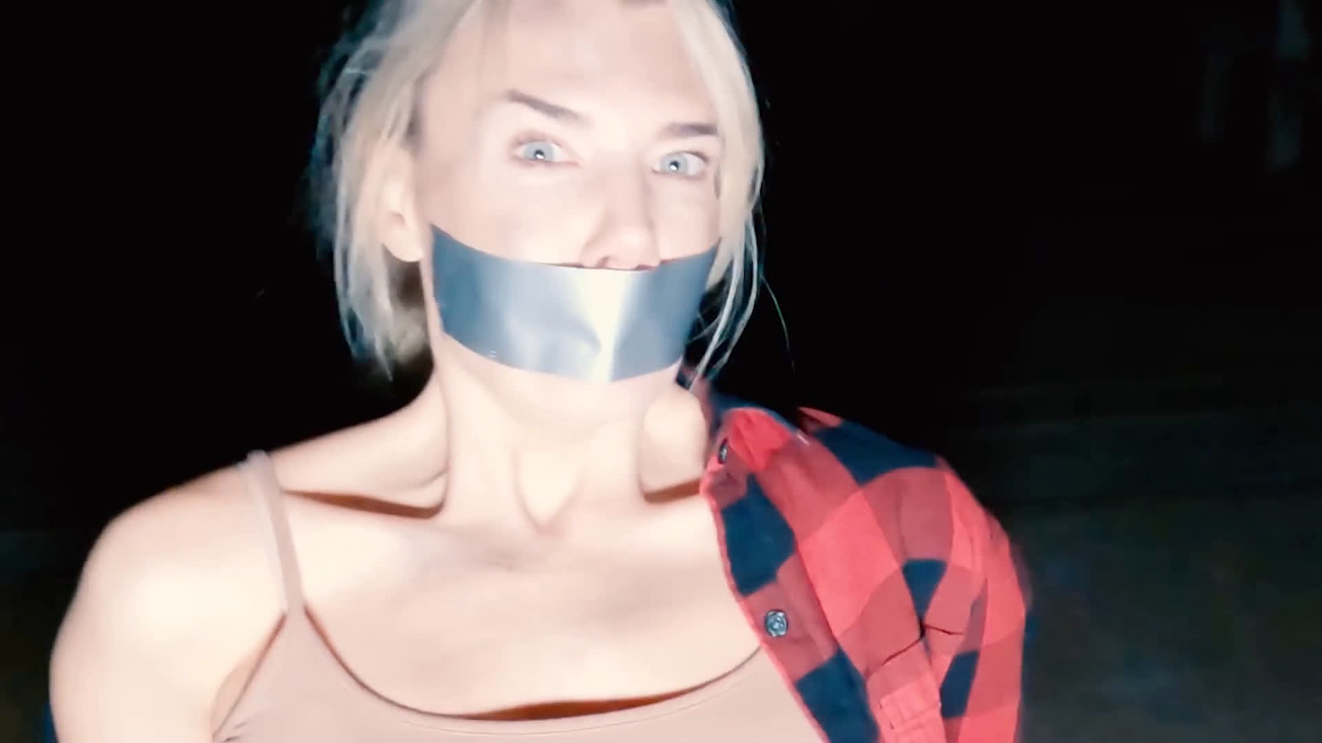 Woman with Mouth Taped shut in Town Full of Ghosts