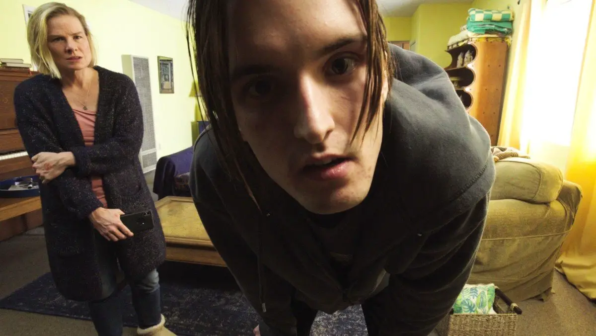 Boy looks into camera lens in M.O.M.