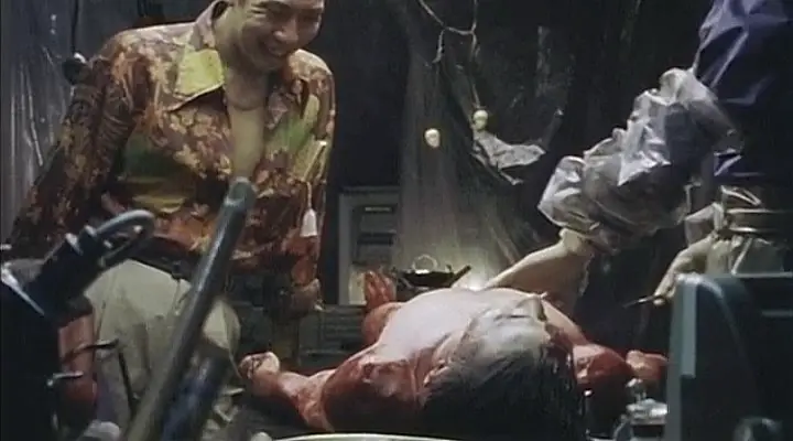Organ still - man looks over guy on table