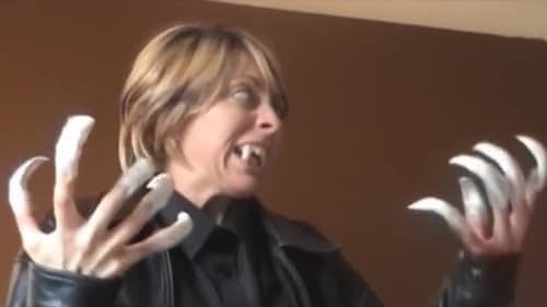 Woman sports fangs and claws