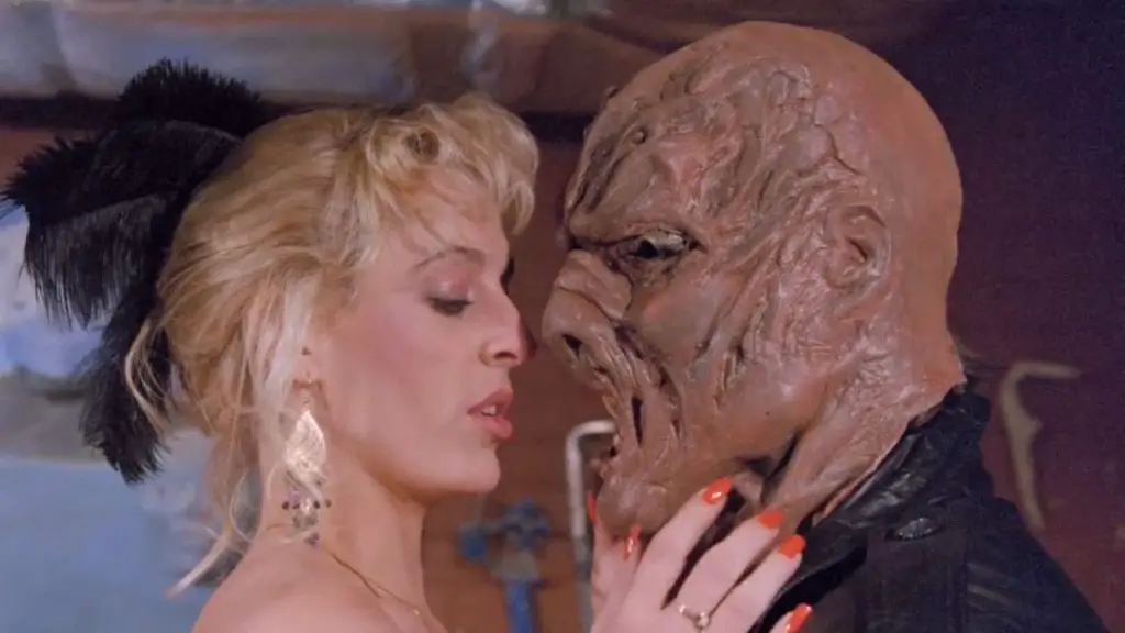 Girl Kisses Monstrous figure