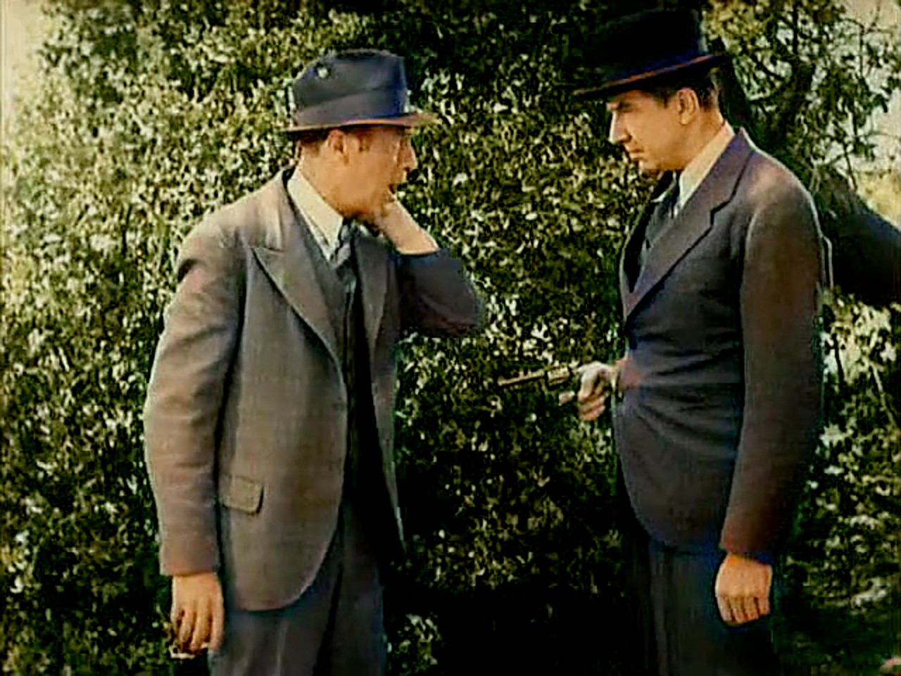 Bela Lugosi menaces guy with gun in Speeding Doom Episode