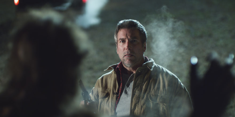 Big Bad still - man faces creature in foreground