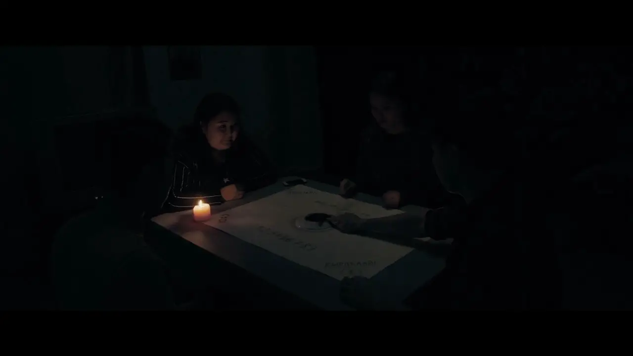 People around a Ouija board