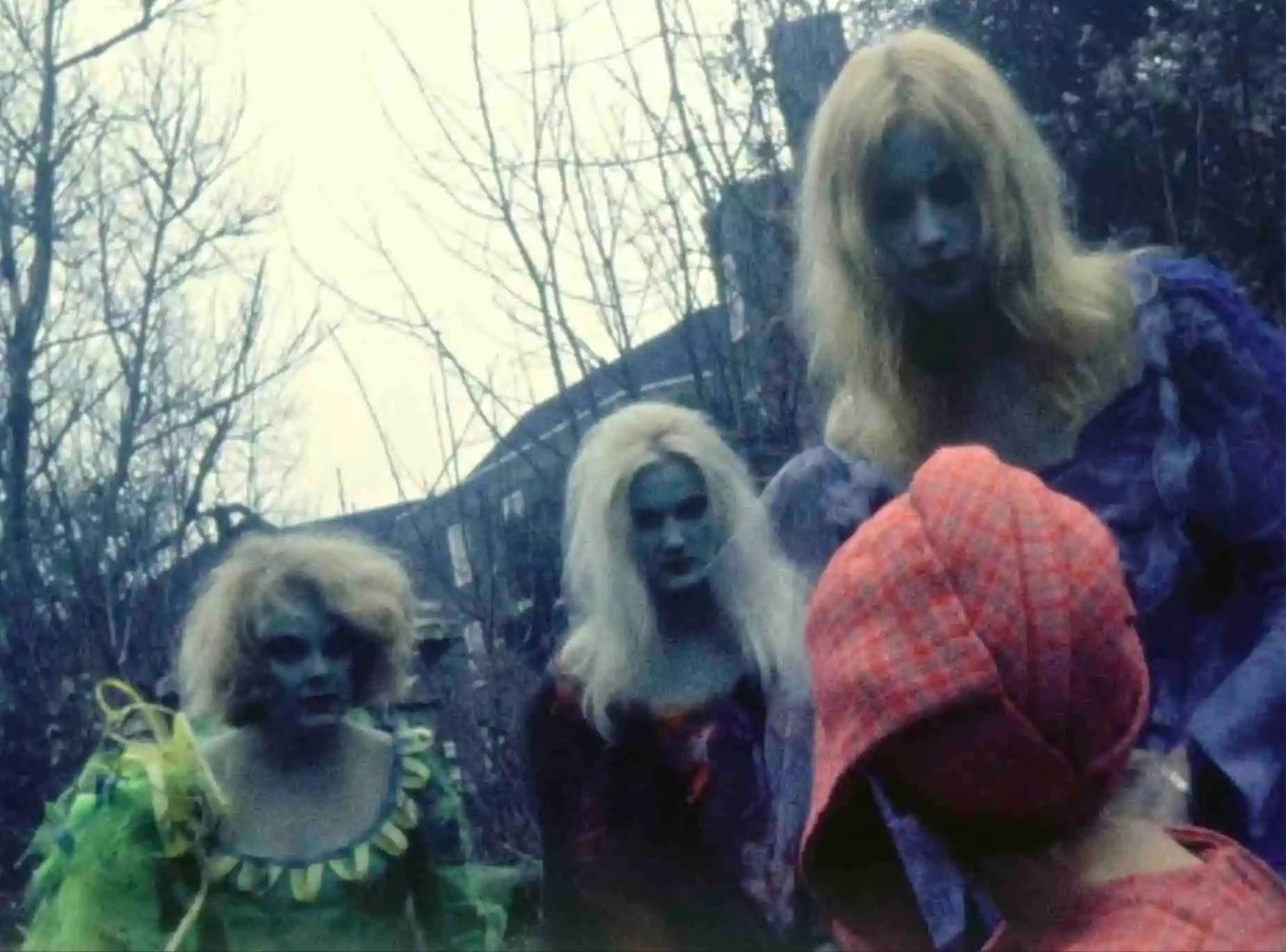 Greenish vampires look at a victim