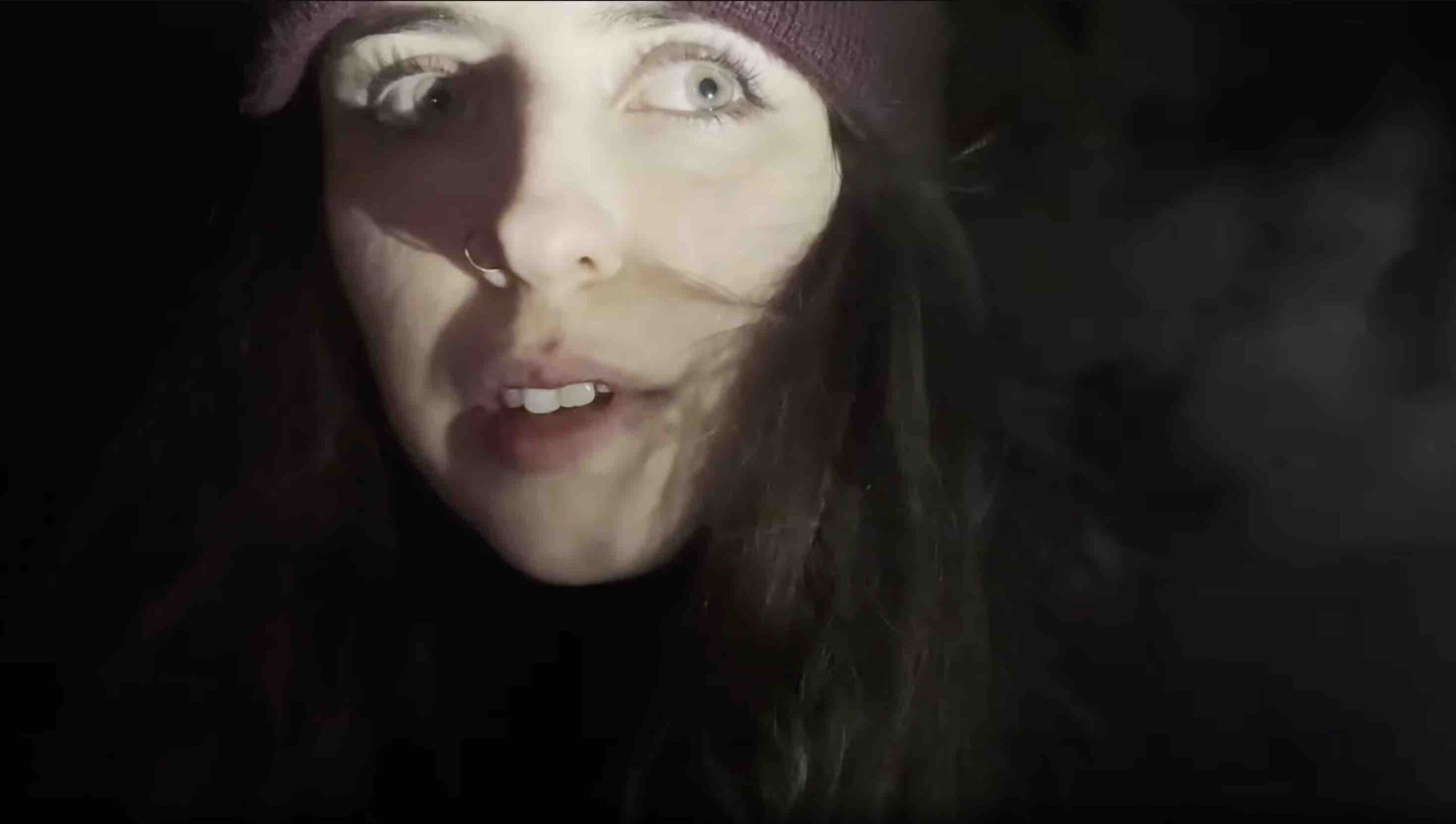 Girl looks into darkness in Beyond the North Woods