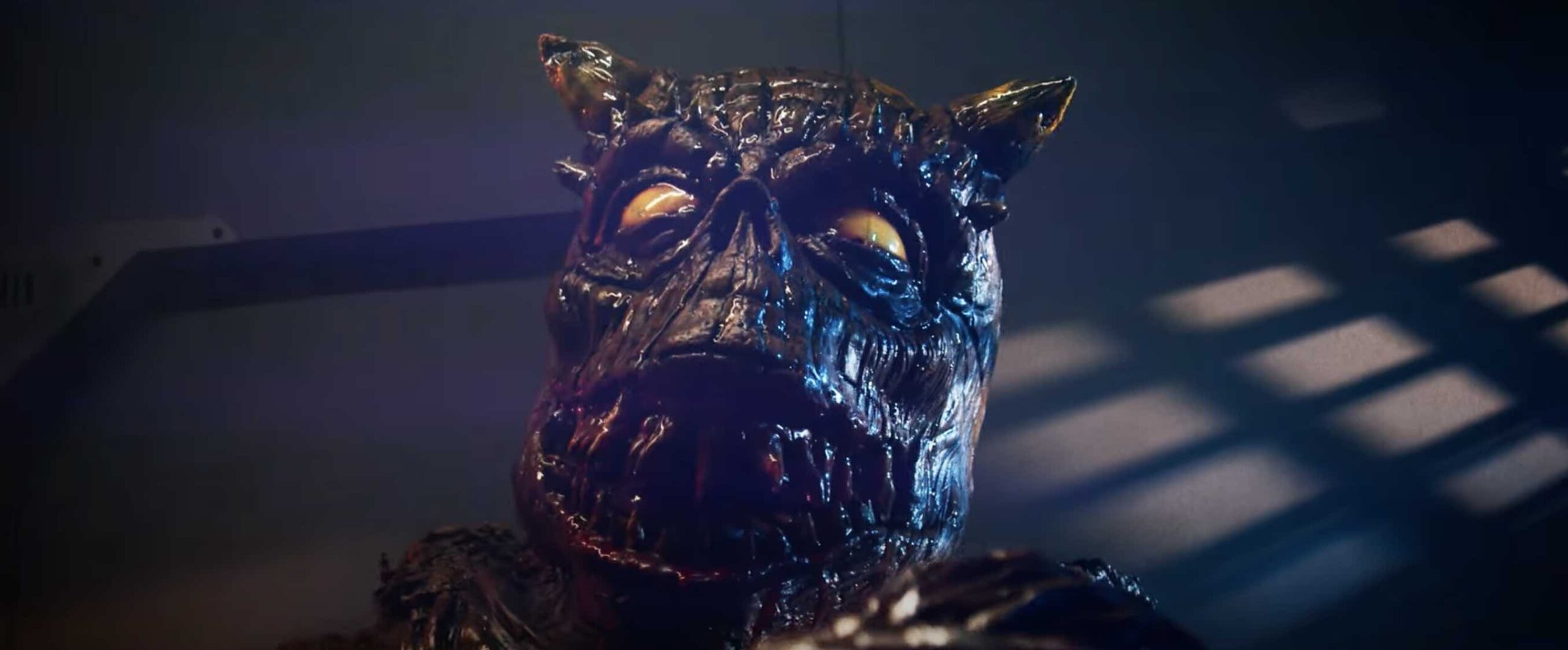 Alien creature with scales and pointed ears