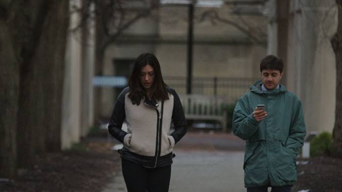 Man and woman walk in blue hour