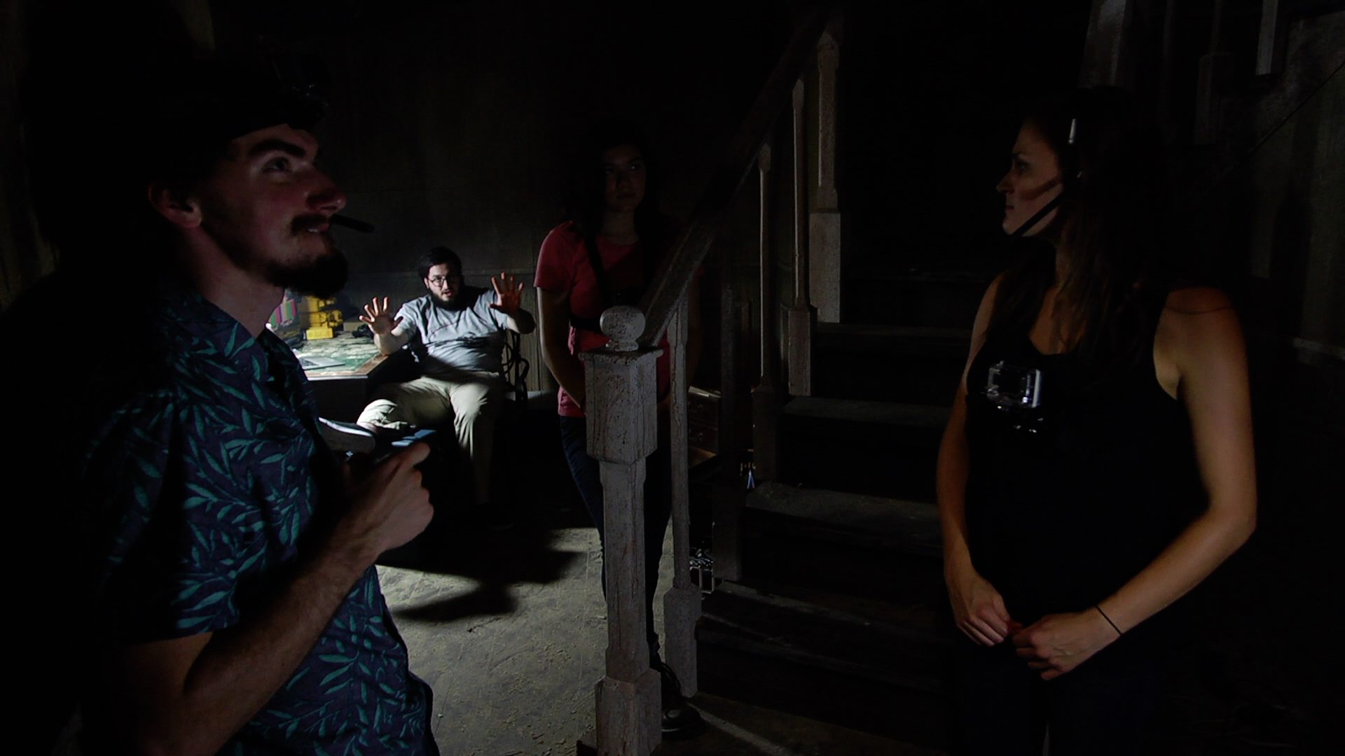 Friends gather in dark house