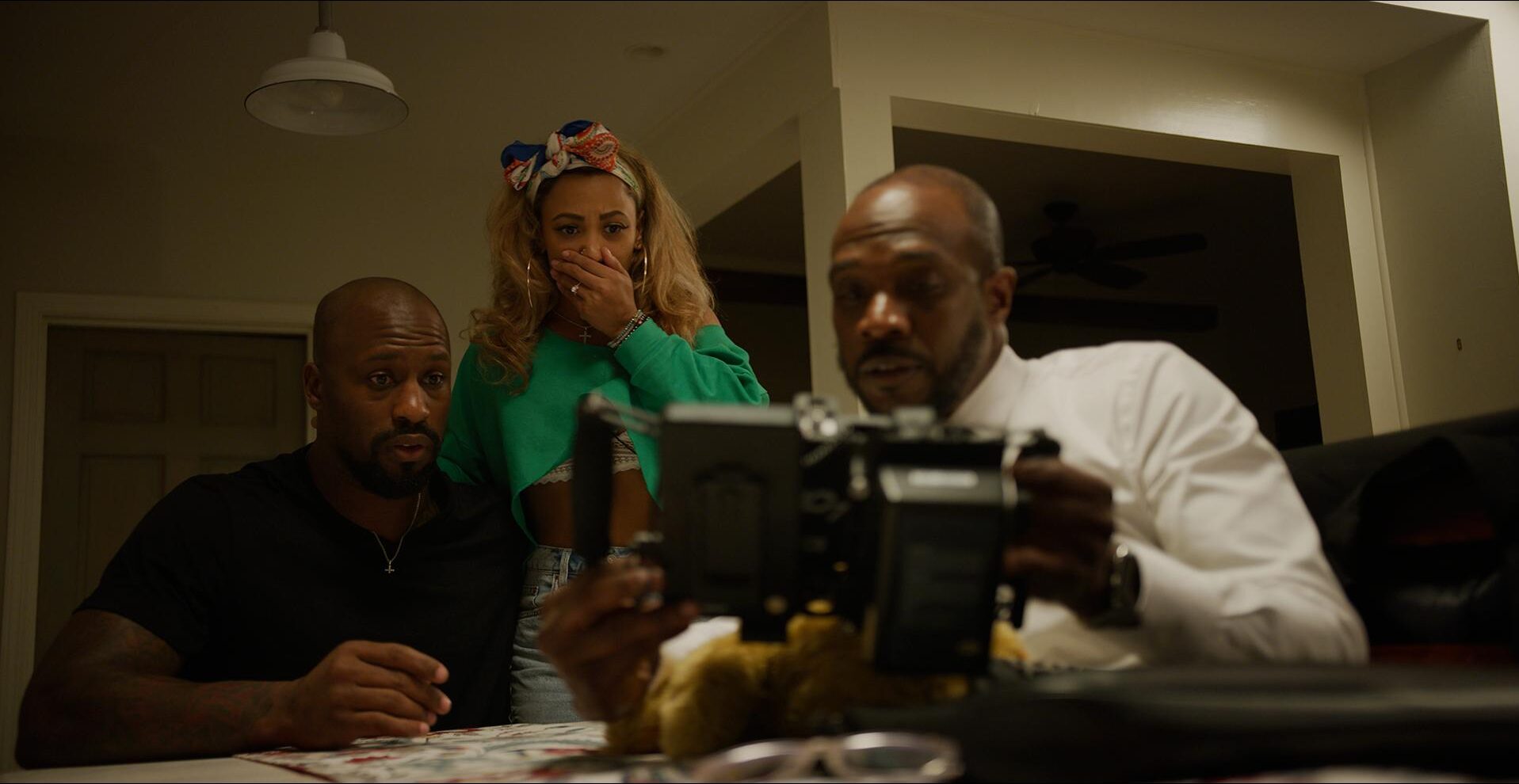 Family looks at a message in A Message from Brianna