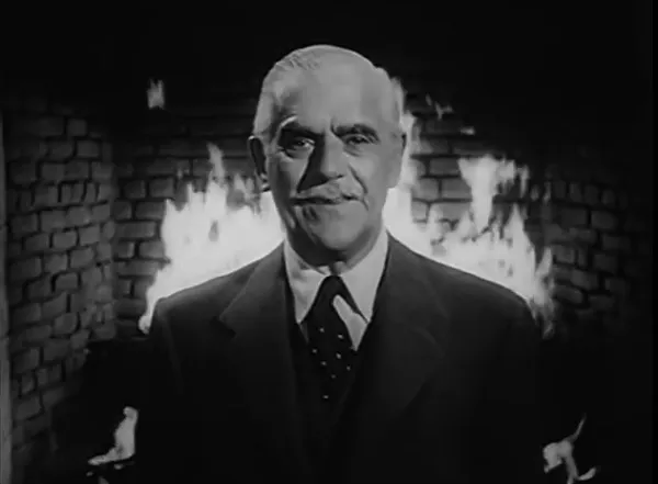 Boris in front of fire in The Veil