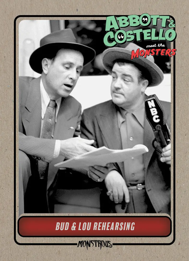 Bud and Lou look over a script beside and NBC microphone