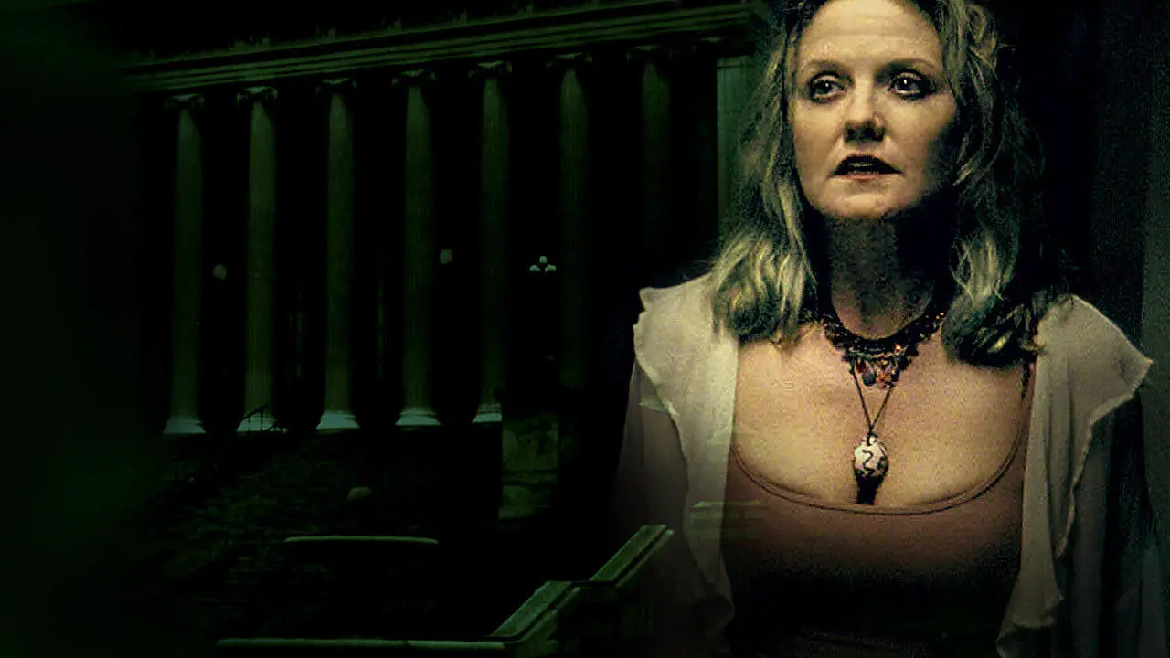 Woman in shadowy room looks off camera