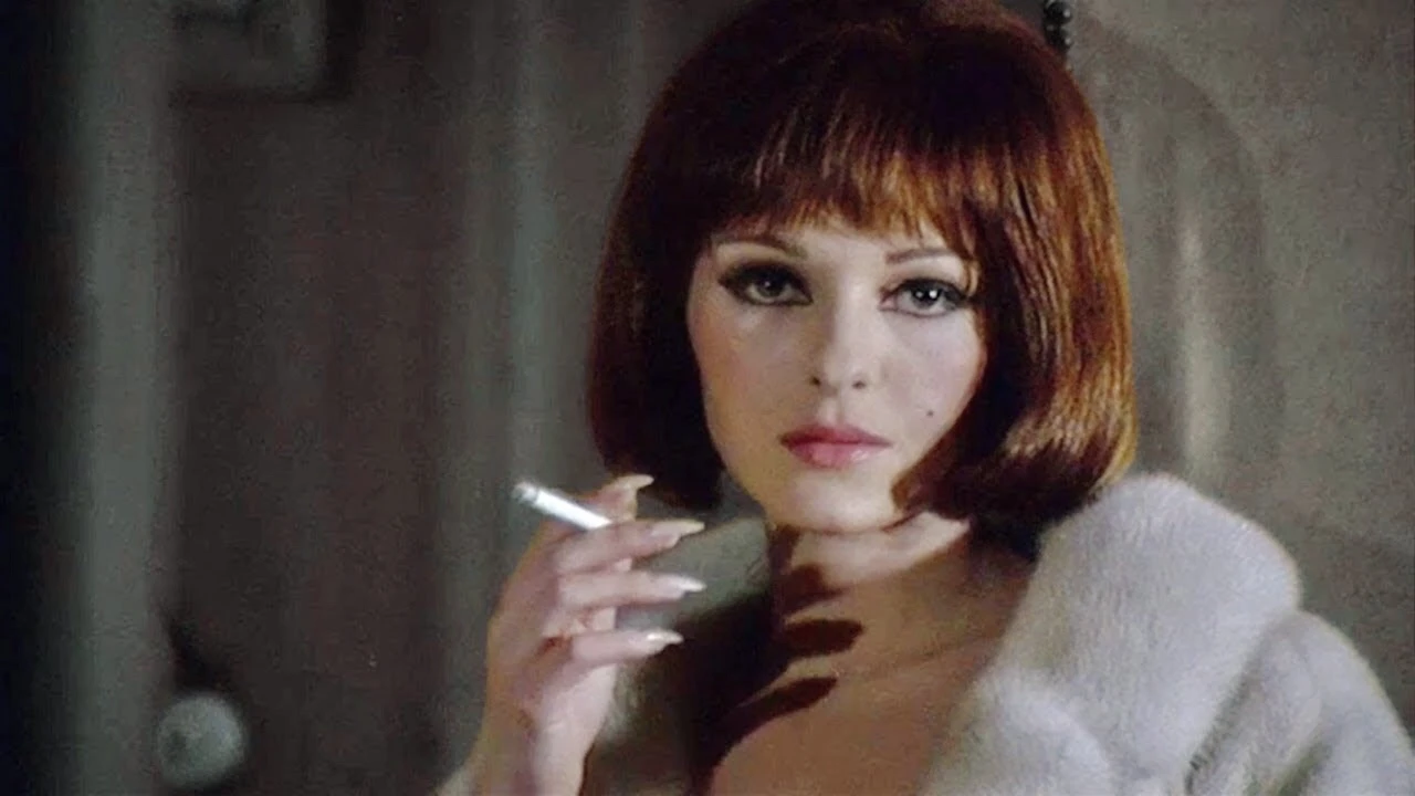 Woman in fur coat smokes a cigarette and stares toward camera