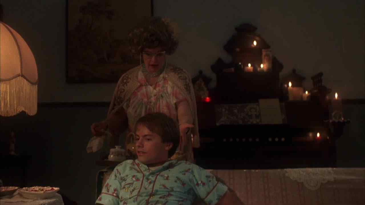 Hoax (Stephen Geoffreys) on the couch after being reprimanded by his mother in Robert Englund's 976-Evil.