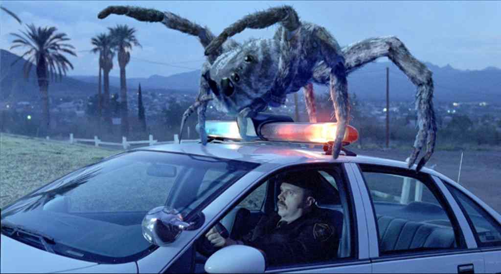 the movie poster for the film eight legged freaks, starring david arquette. 