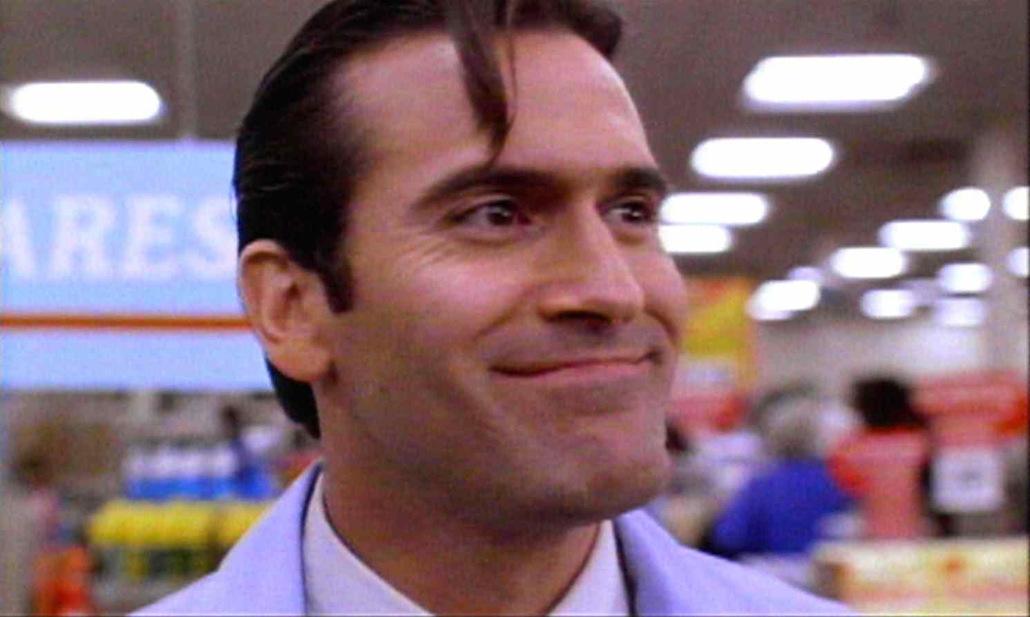 Ash (Bruce Campbell) as an S-Mart clerk in Sam Raimi's Army of Darkness.