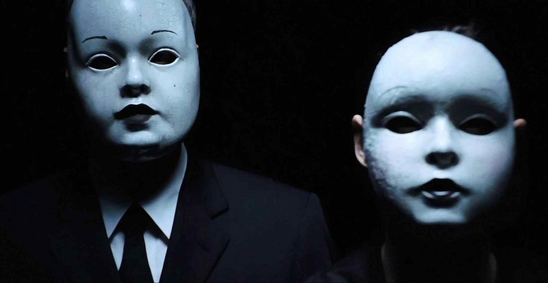 The masked killers from one of the possible scenarios in Drew Goddard's 2012 horror film The Cabin in the Woods.