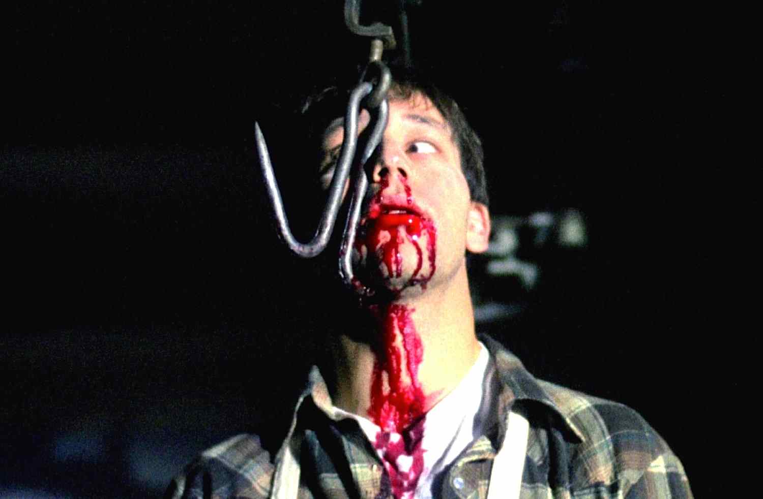 The meat hook death scene in the 1989 Scott Spiegel slasher film Intruder.
