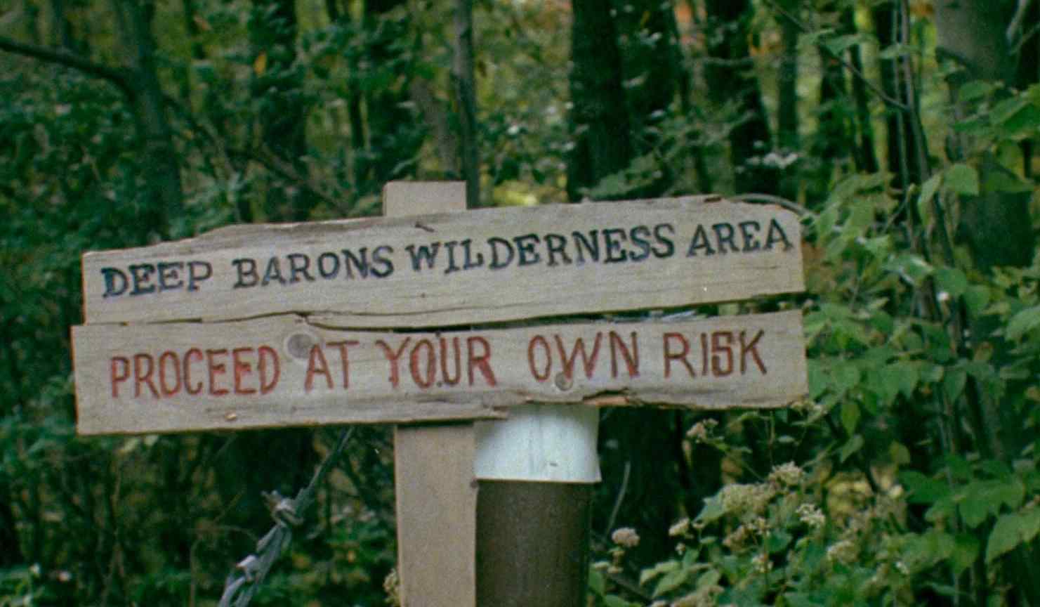A warning in Charles Kaufman's revenge horror film Mother's Day 1980.