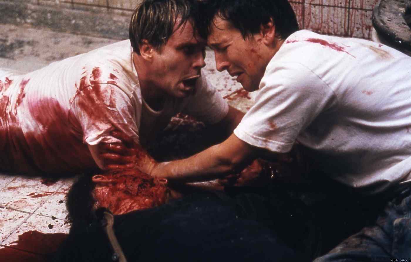 A photo of Leigh Whannell and Cary Elwes in James Wan's Saw.