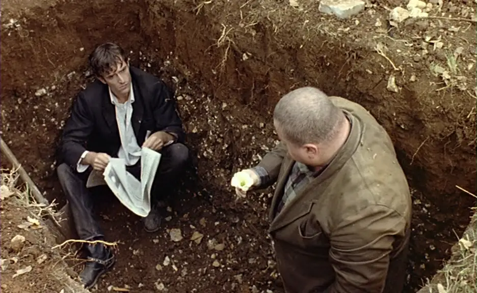 Dellamorte gets to work digging a new grave
