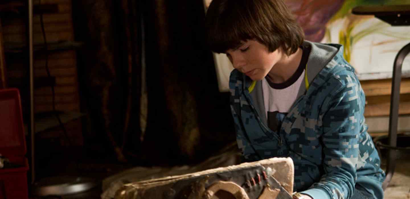 Chandler Riggs and ancient book in Mercy