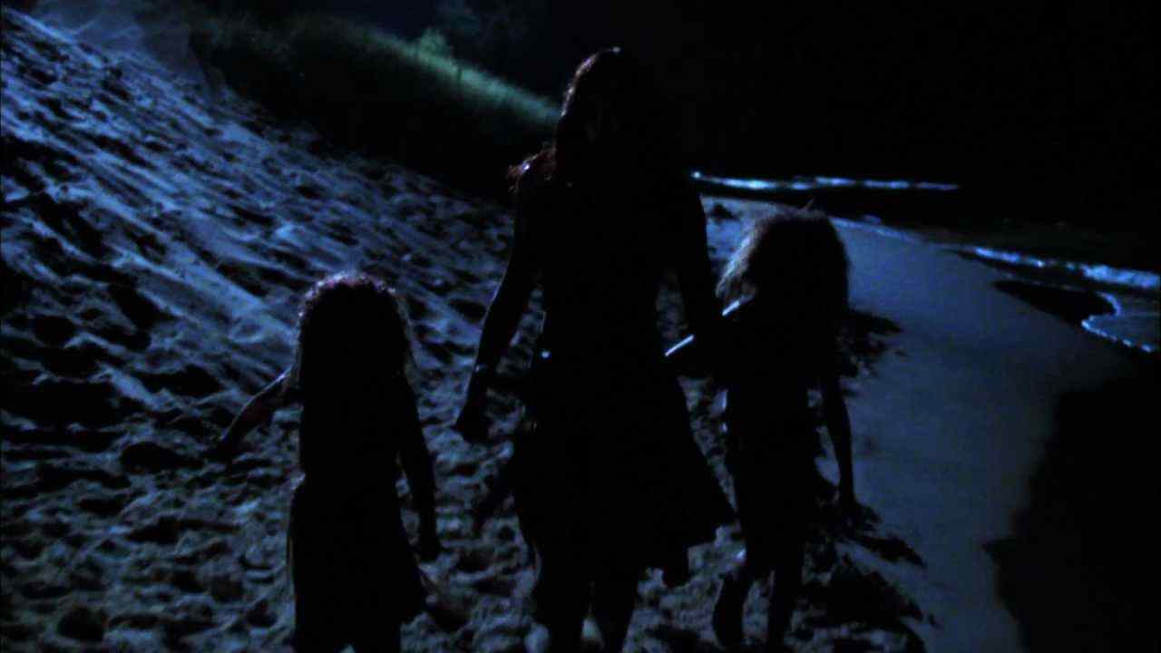 The cannibal family walks on the beach back to their cave in Offspring.