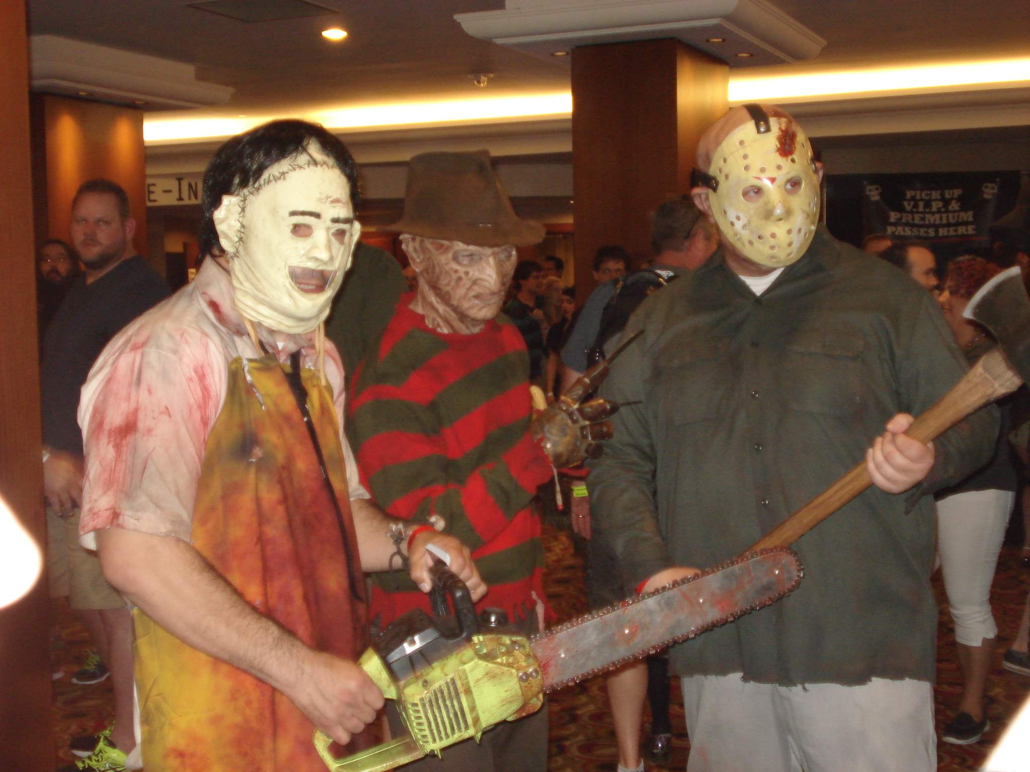 Cosplayers dressed as Leatherface, Freddy Krueger, and Jason Voorhees pose for pictures at Texas Frightmare Weekend