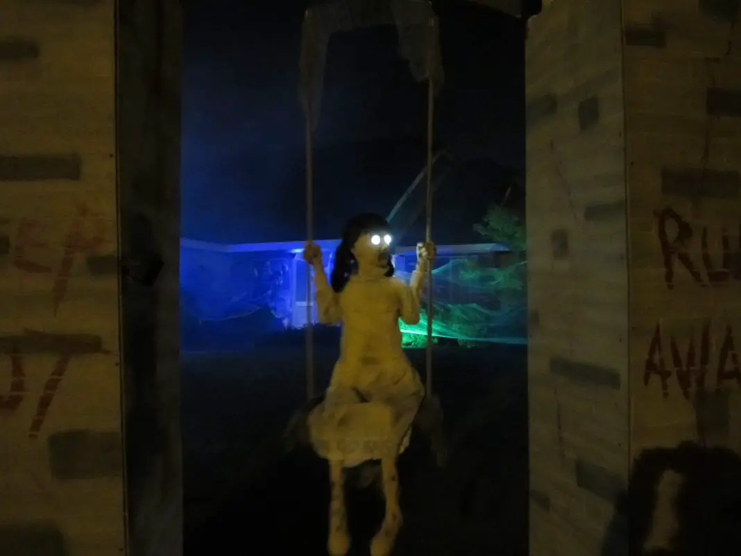 creepy doll on swing