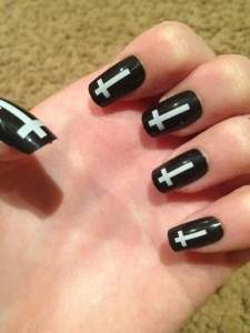 black upside crosses nail art. 