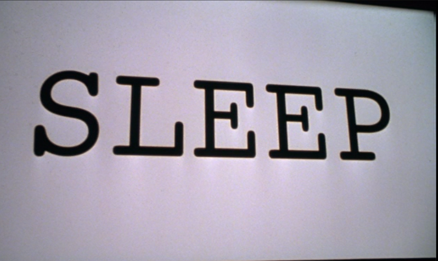 the word 'sleep' appears on the movie screen in Stir of Echoes