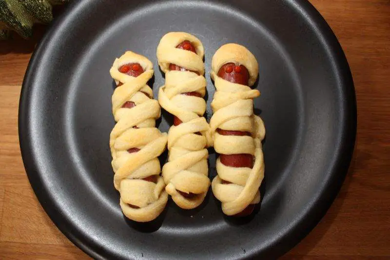 Hotdog mummies for a spooky and creepy Halloween treat.