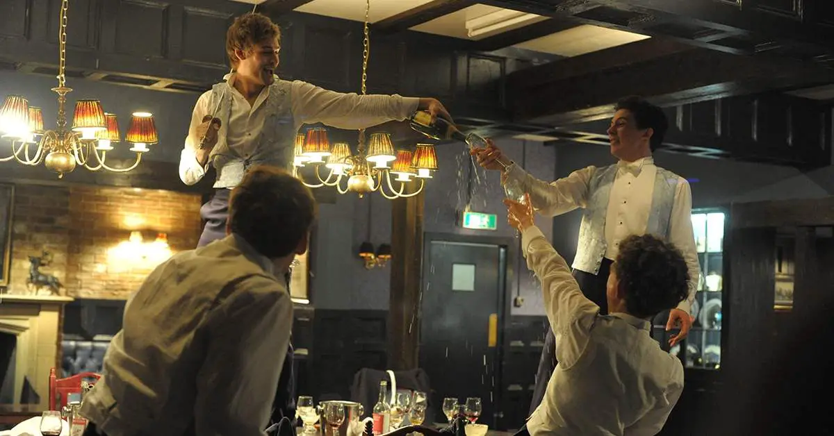 Douglas Booth toasting in The Riot Club