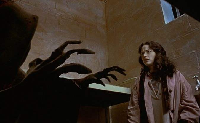 The cloaked figure of death comes for Lucy in Frank's jail cell in The Frighteners