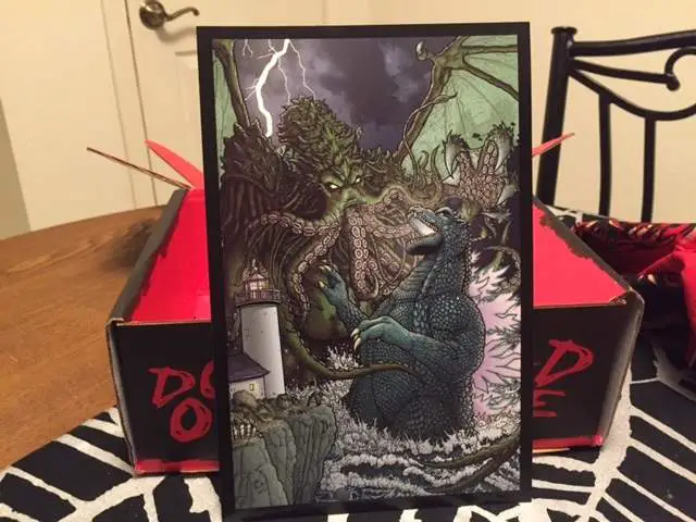 A Godzilla vs. Cthulhu print by Paul Hanley in the December 2015 Horror Block