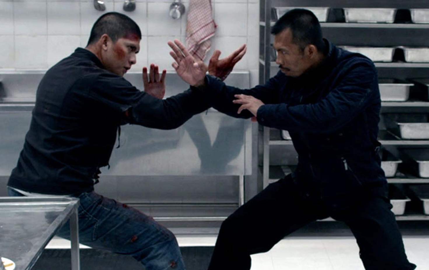 Rama and foe get into an epic an elaborate fight scene in a kitchen in The Raid 2.