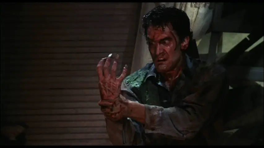 Ash and possessed hand in Evil Dead 2