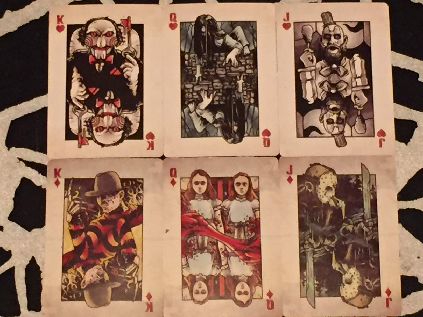 Two sets of face cards in the deck of playing cards included in February 2016's Horror Block