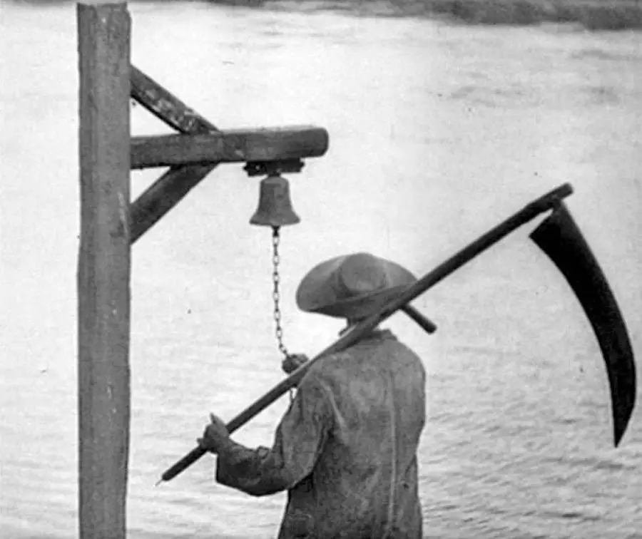 A man holding a scythe