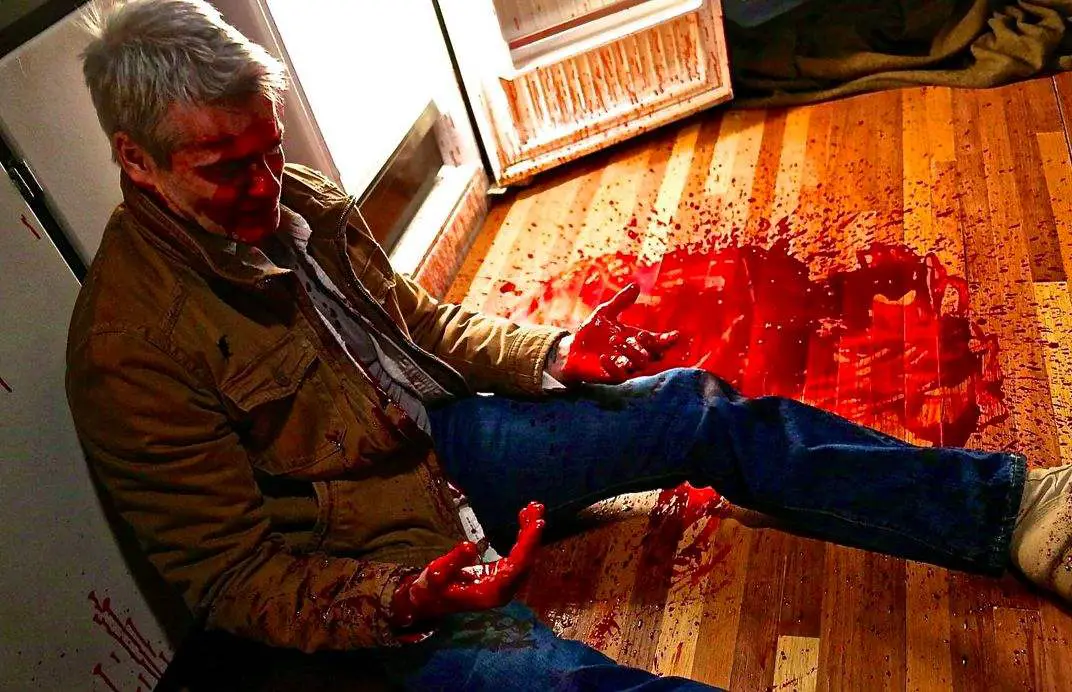 Henry Rollins bloodied in He Never Died