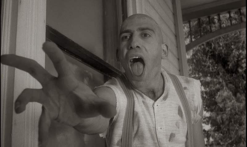 Sid Haig as Ralph reaches creepily for Carol Ohmart in Spider Baby