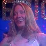 Carrie smiling as prom queen