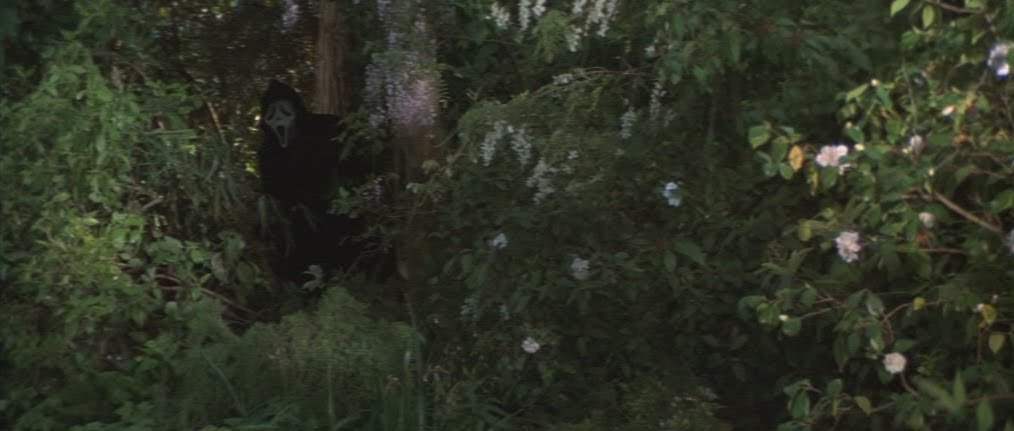 Ghostface hiding in bushes