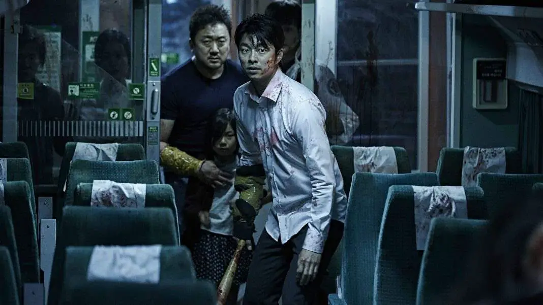 Passengers attempt to move through the hordes of zombies on the Train to Busan