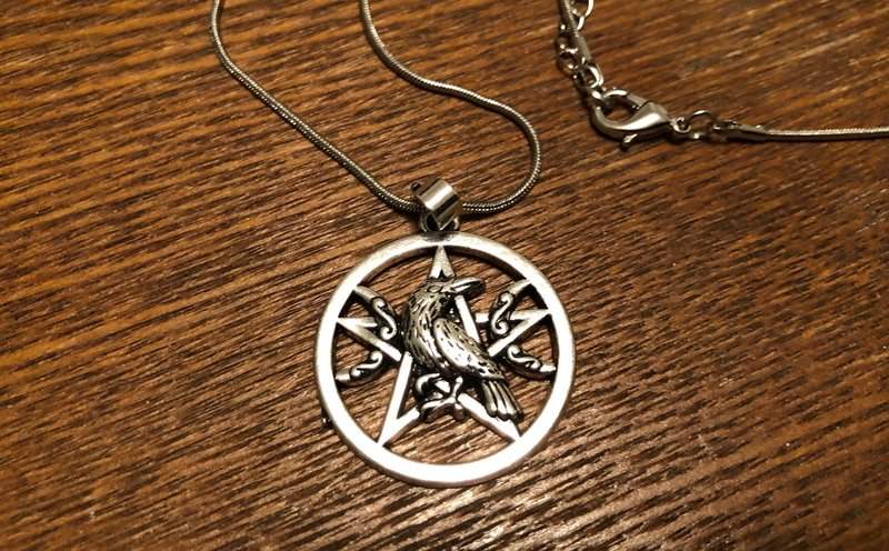 Raven and pentacle necklace in the April 2019 Creepy Crate