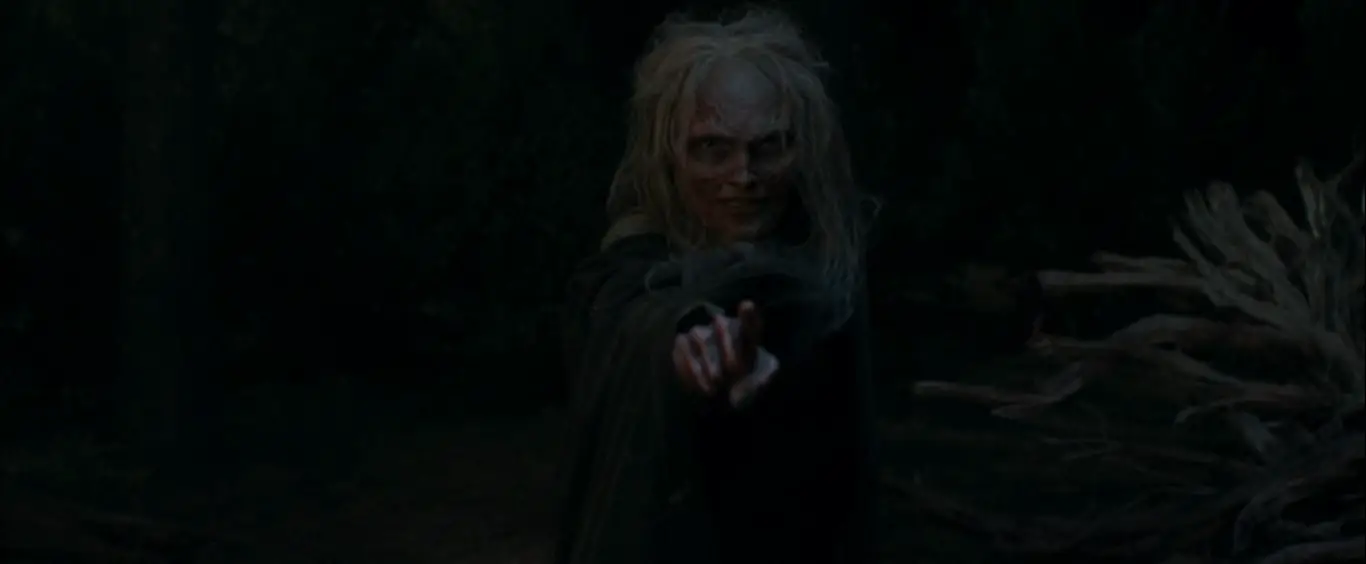 A witch zombie pointing