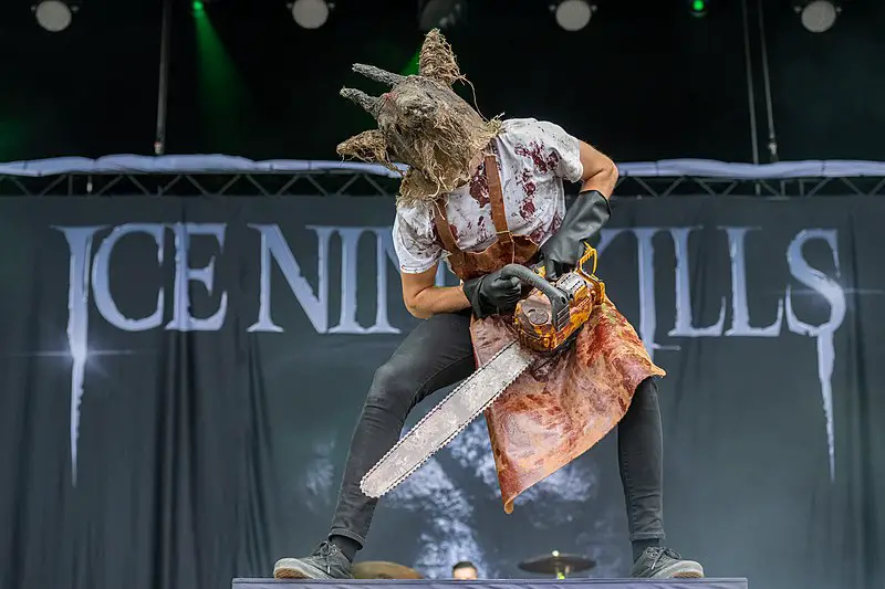 An Ice Nine Kills member on stage dressed in a horror costume.