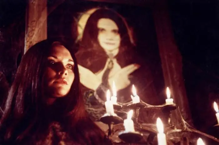 Satanist with candles